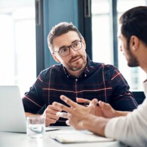 Shot of two businessmen having a discussion in an office